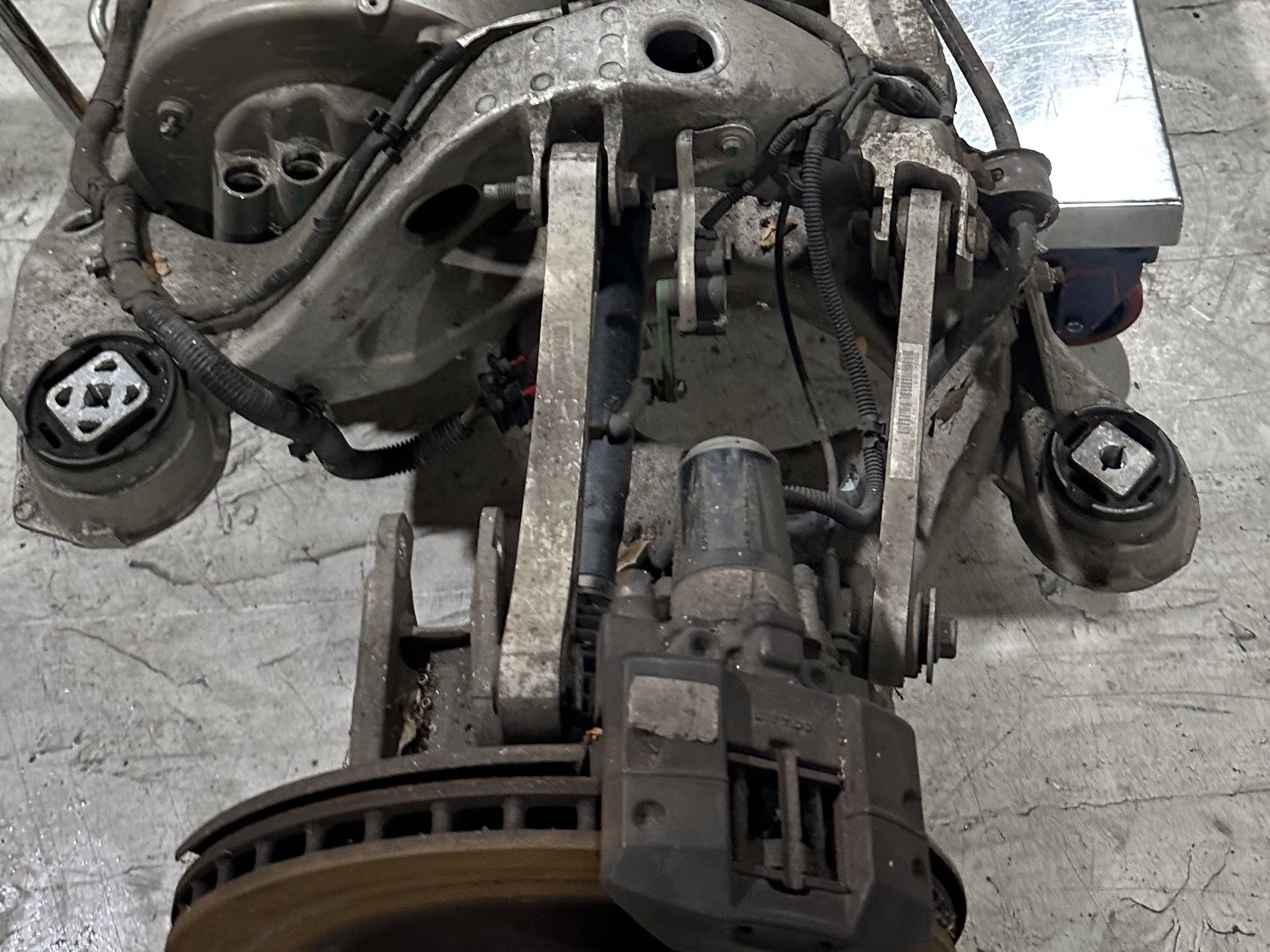 Tesla rear subframe with suspension control arms at HighVolt EV in Harrisburg, NC, near Charlotte