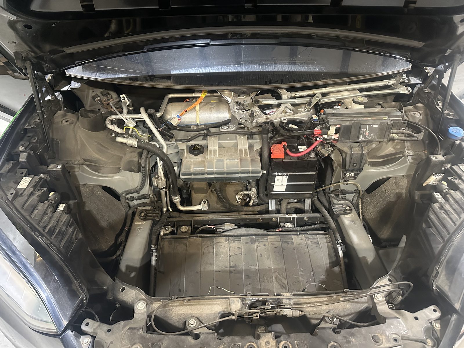 Tesla front trunk opened for heat pump and thermal system repair at HighVolt EV in Harrisburg, NC, near Charlotte