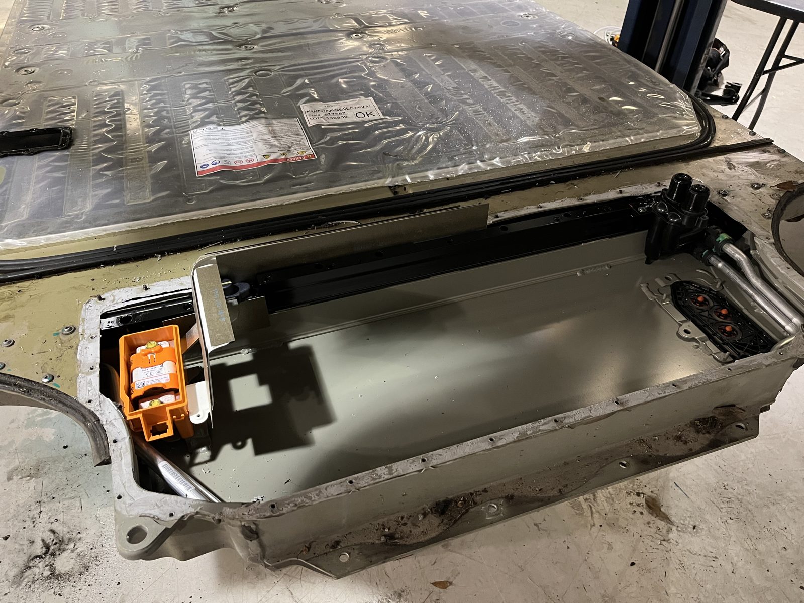 Tesla pyro fuse replacement inside an opened high-voltage battery pack